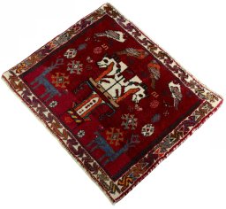 Corner detail of 2000s Shiraz rug showing border pattern and Wool pile