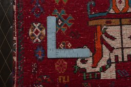 Backside of handmade 2000s Shiraz rug showing knot structure and weave density