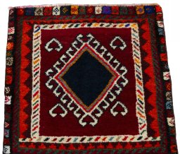 Surface texture of 2000s Shiraz rug with natural Wool and intricate pattern
