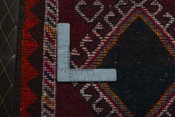 Backside of handmade 2000s Shiraz rug showing knot structure and weave density