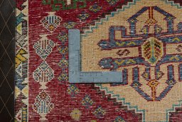Backside of handmade 2000s Shiraz rug showing knot structure and weave density