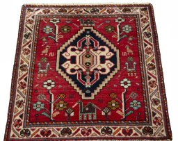 Surface texture of 2000s Shiraz rug with natural Wool and intricate pattern
