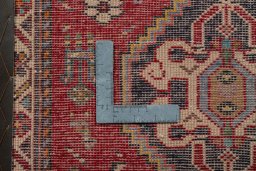 Backside of handmade 2000s Shiraz rug showing knot structure and weave density