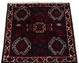 Surface texture of 2000s Shiraz rug with natural Wool and intricate pattern