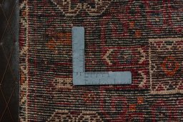 Backside of handmade 2000s Shiraz rug showing knot structure and weave density