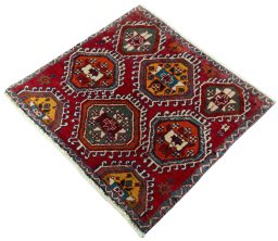 Corner detail of 2000s Shiraz rug showing border pattern and Wool pile