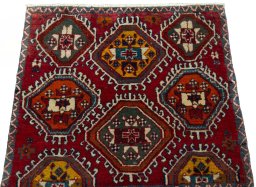 Surface texture of 2000s Shiraz rug with natural Wool and intricate pattern