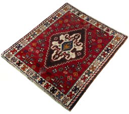 Corner detail of 2000s Shiraz rug showing border pattern and Wool pile