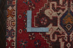 Backside of handmade 2000s Shiraz rug showing knot structure and weave density