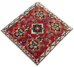 Corner detail of 2000s Shiraz rug showing border pattern and Wool pile