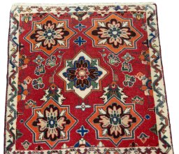 Surface texture of 2000s Shiraz rug with natural Wool and intricate pattern
