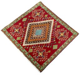 Corner detail of 2000s Shiraz rug showing border pattern and Wool pile