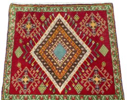 Surface texture of 2000s Shiraz rug with natural Wool and intricate pattern