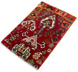 Corner detail of 2000s Shiraz rug showing border pattern and Wool pile