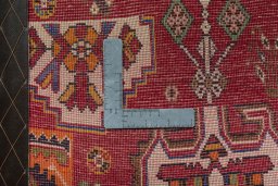 Backside of handmade 2000s Shiraz rug showing knot structure and weave density