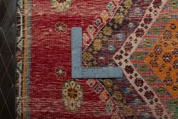 Backside of handmade 2000s Shiraz rug showing knot structure and weave density