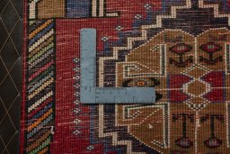 Backside of handmade 2000s Shiraz rug showing knot structure and weave density