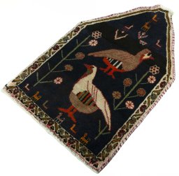Corner detail of 2000s Shiraz rug showing border pattern and Wool pile