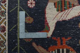 Backside of handmade 2000s Shiraz rug showing knot structure and weave density