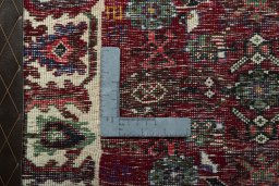 Backside of handmade 2000s Shiraz rug showing knot structure and weave density