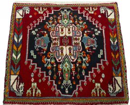 Surface texture of 2000s Shiraz rug with natural Wool and intricate pattern