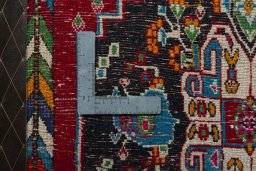 Backside of handmade 2000s Shiraz rug showing knot structure and weave density