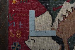 Backside of handmade 2000s Shiraz rug showing knot structure and weave density