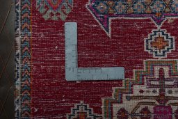 Backside of handmade 2000s Shiraz rug showing knot structure and weave density