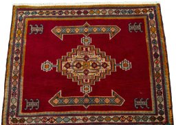 Surface texture of 2000s Shiraz rug with natural Wool and intricate pattern