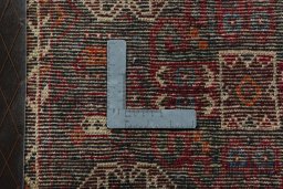 Backside of handmade 2000s Shiraz rug showing knot structure and weave density