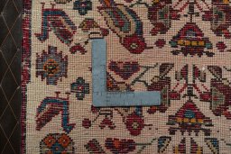 Backside of handmade 2000s Shiraz rug showing knot structure and weave density
