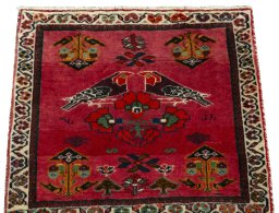 Surface texture of 2000s Shiraz rug with natural Wool and intricate pattern