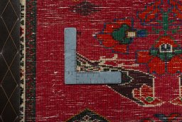 Backside of handmade 2000s Shiraz rug showing knot structure and weave density