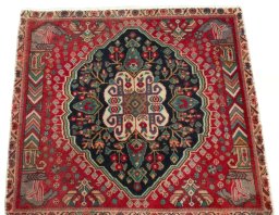 Surface texture of 2000s Shiraz rug with natural Wool and intricate pattern