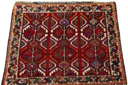 Surface texture of 2000s Shiraz rug with natural Wool and intricate pattern