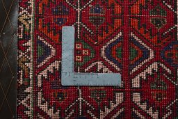 Backside of handmade 2000s Shiraz rug showing knot structure and weave density