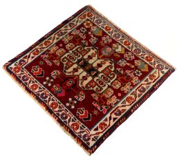 Corner detail of 2000s Shiraz rug showing border pattern and Wool pile