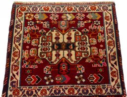 Surface texture of 2000s Shiraz rug with natural Wool and intricate pattern
