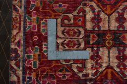 Backside of handmade 2000s Shiraz rug showing knot structure and weave density