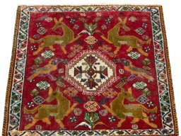 Surface texture of 2000s Shiraz rug with natural Wool and intricate pattern