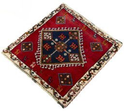 Corner detail of 2000s Shiraz rug showing border pattern and Wool pile