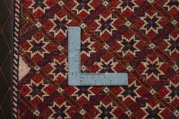 Backside of handmade 2000s Shiraz rug showing knot structure and weave density