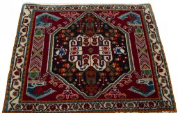 Surface texture of 2000s Shiraz rug with natural Wool and intricate pattern
