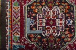 Backside of handmade 2000s Shiraz rug showing knot structure and weave density