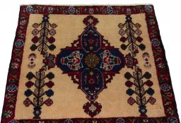 Surface texture of 2000s Shiraz rug with natural Wool and intricate pattern