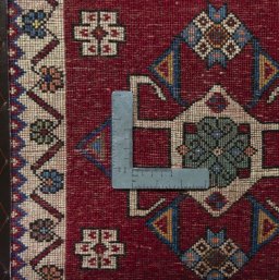 Backside of handmade 2000s Shiraz rug showing knot structure and weave density