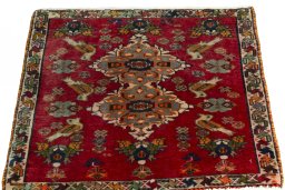 Surface texture of 2000s Shiraz rug with natural Wool and intricate pattern