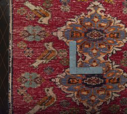Backside of handmade 2000s Shiraz rug showing knot structure and weave density