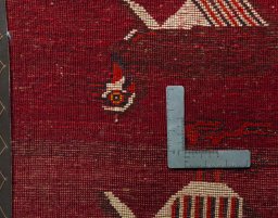 Backside of handmade 2000s Shiraz rug showing knot structure and weave density