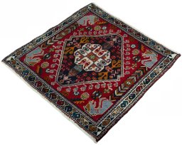 Corner detail of 2000s Shiraz rug showing border pattern and Wool pile